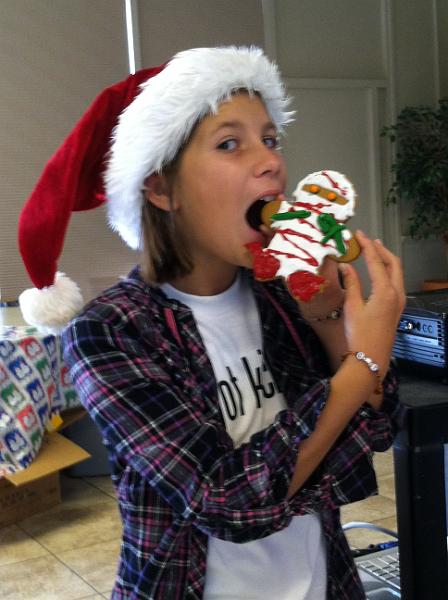 img_2515.jpg - Kayla eats her Ninja gingerbread man