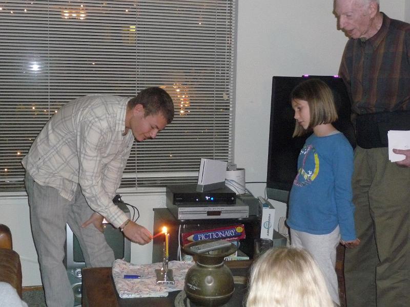 p1080404.jpg - Jay lights the menorah