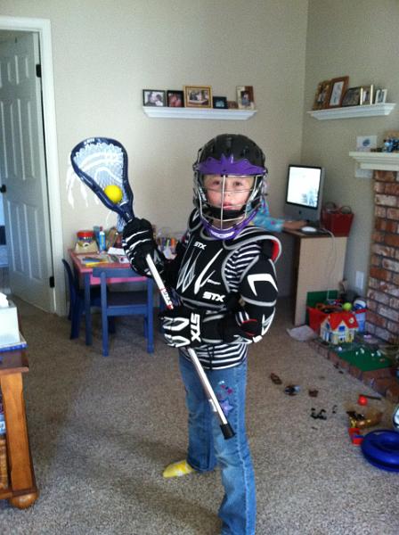 img_1331.jpg - Kinsey trying on her new lacrosse gear