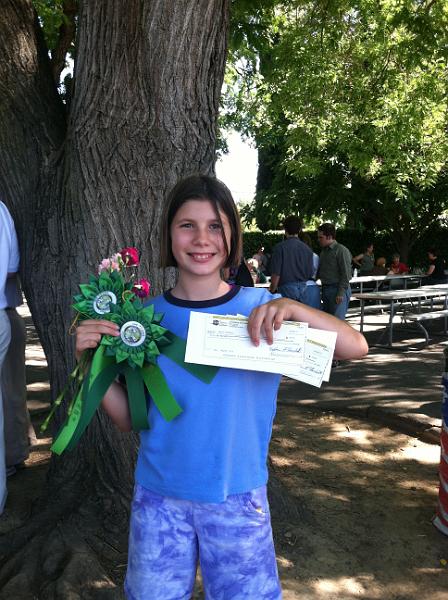 img_1683.jpg - Kayla collecting her awards from the Alameda County Fair