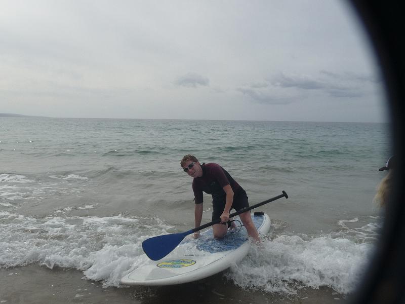 p1080502.jpg - Robin tries out the paddleboard - it was fun!